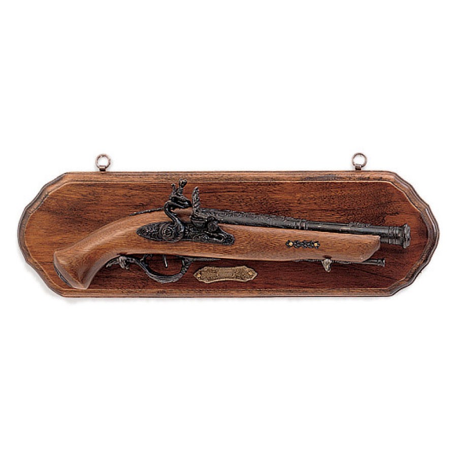 Wooden panoply with old pistol